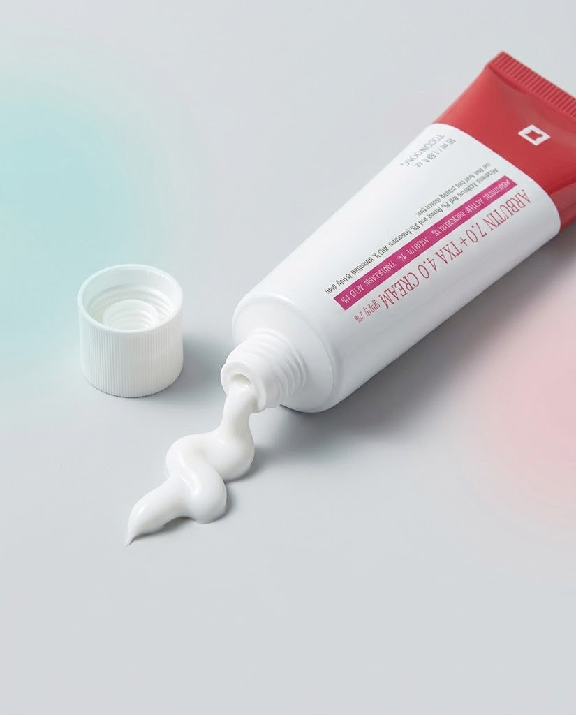 Arbutin 7.0 + TXA 4.0 Cream tube with cream flowing from the nozzle