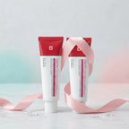 Buy 1 Get 1 Free: two cream tubes with pink ribbon